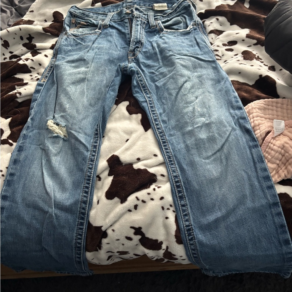 Distressed Blue Denim Jeans